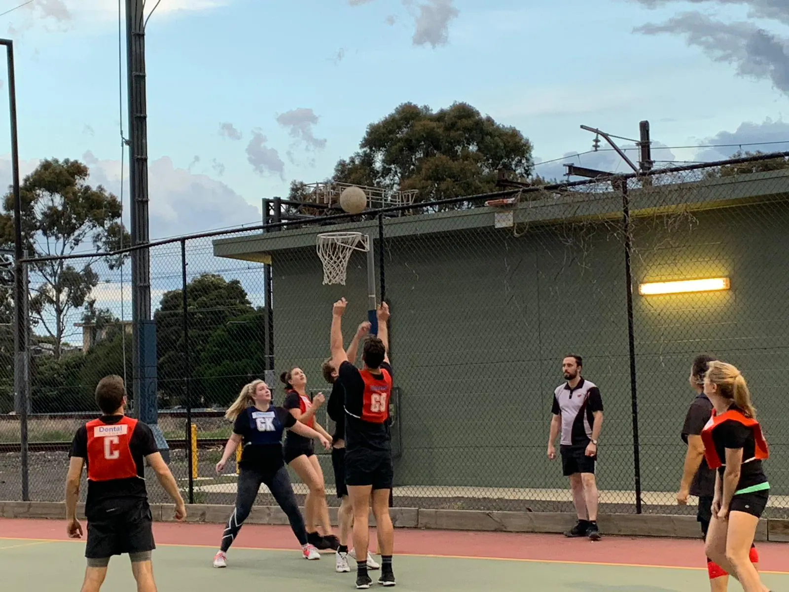 A shot at the ring, outdoor court at dusk · 2020